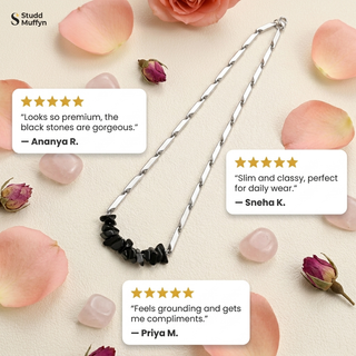 Flat-lay with three five-star customer review cards for the Obsidian necklace