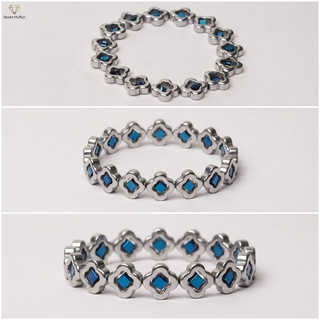 Multi-angle clean catalog collage of the silver blue clover bracelet