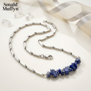 Lapis Lazuli crystal rice chain pendant necklace displayed on a bright premium set