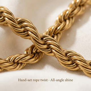 Macro close-up of the twisted gold-toned rope link pattern of the Signature Rope Chain