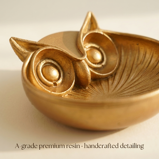 Close-up of the owl face and fine inner ridge detailing on the golden bowl