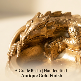 Close-up of the dragon's scaled body and antique gold finish on the money bowl