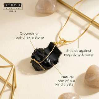 Macro of black obsidian crystal with three benefit callouts on a cream background