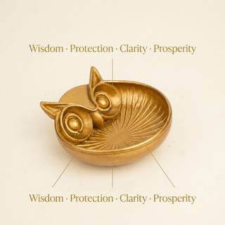 Golden owl money bowl with text describing its symbolism of wisdom and prosperity