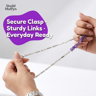 Amethyst necklace chain held taut to show sturdy links and secure clasp