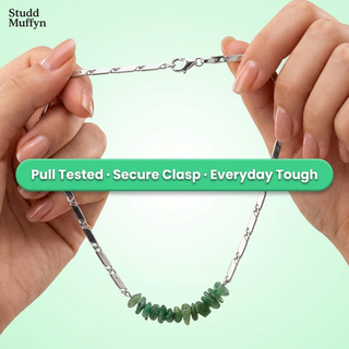 Green Aventurine necklace chain held taut in a strength test