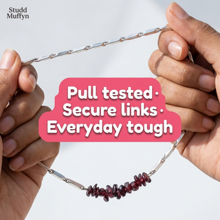 Necklace chain held taut in a pull test