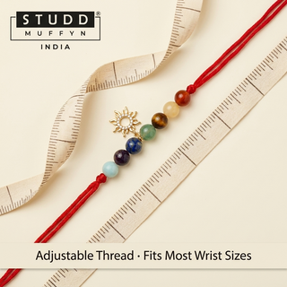 Sunshine 7 Chakra Rakhi on a soft measuring tape showing adjustable fit