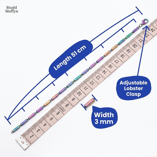 Necklace laid along a tape measure showing length and width callouts
