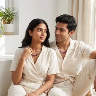 A woman and a man both wearing the amethyst silver-tone chain necklace