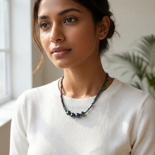 Woman wearing the Prism Hematite Rice Chain Necklace over a neutral outfit